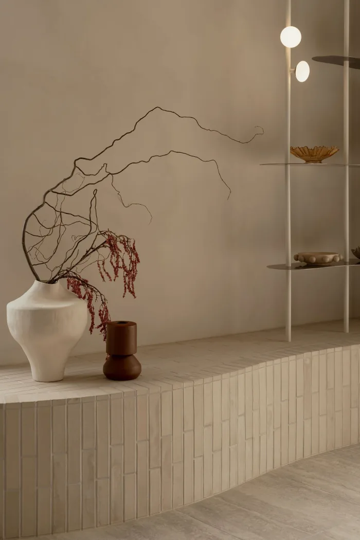 A ceramic vessel and styled shelf detail in a ZOEI bedroom.