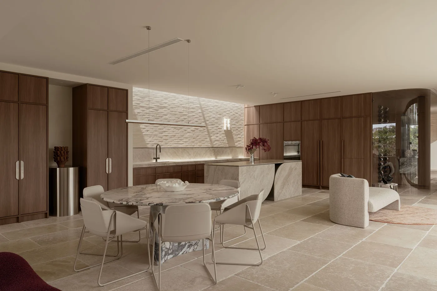 The dining table and sculptural chairs beside the kitchen at ZOEI, a product and interiors photoshoot location on the Gold Coast.