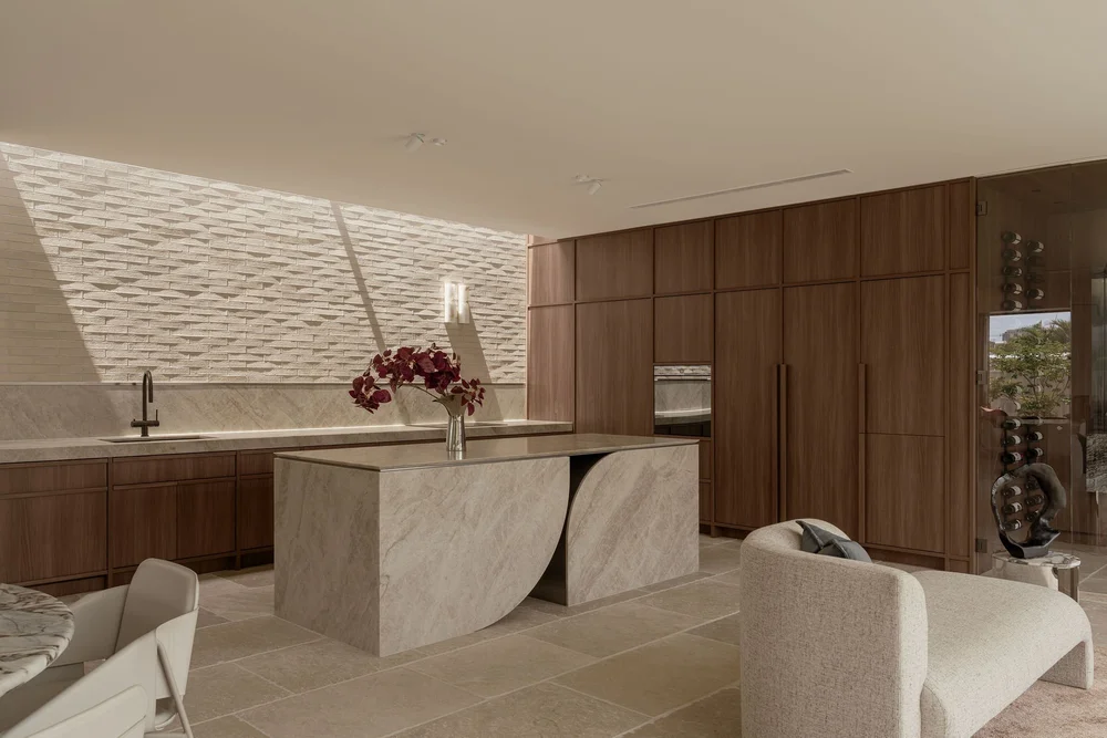Kitchen and dining at ZOEI seen across the limestone floor.