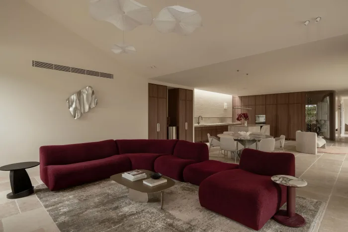 The wine bouclé modular sofa and dining beyond at ZOEI.