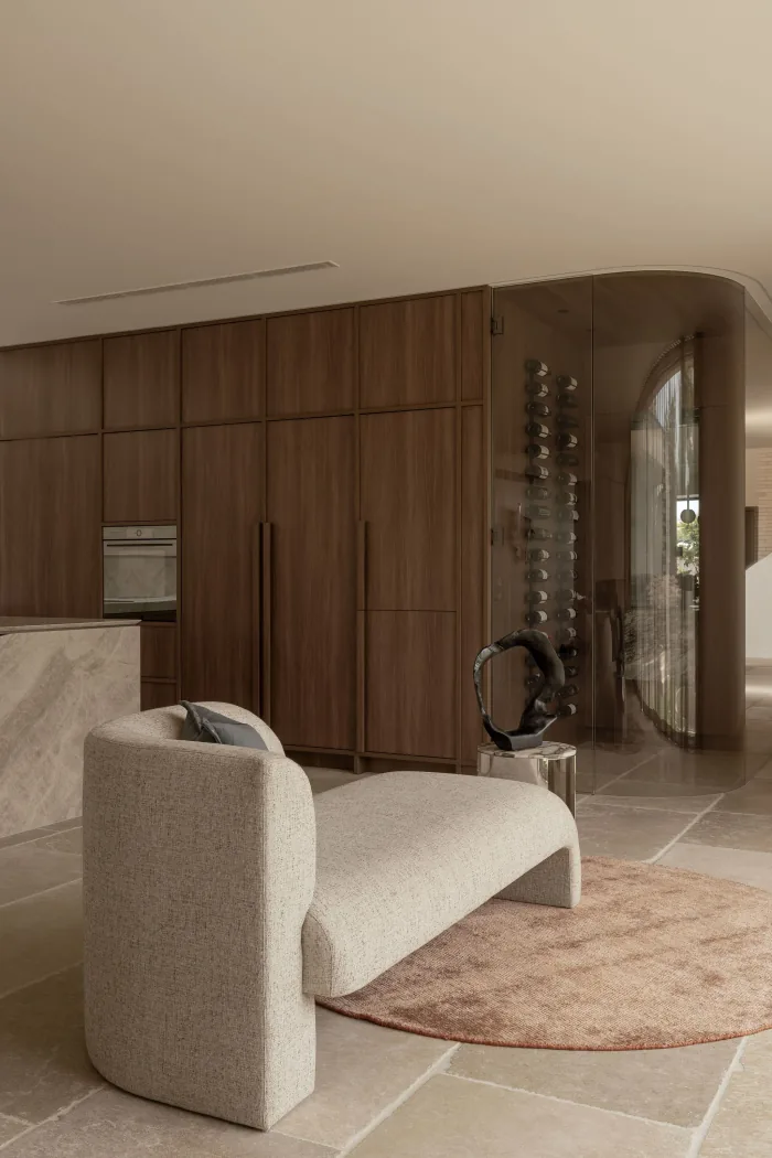 The curved glass wine room at the entry to ZOEI.