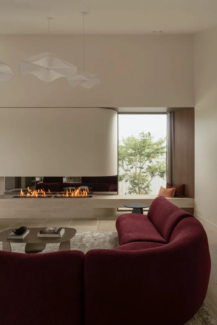 Sculptural pendant lighting above the ZOEI living room.