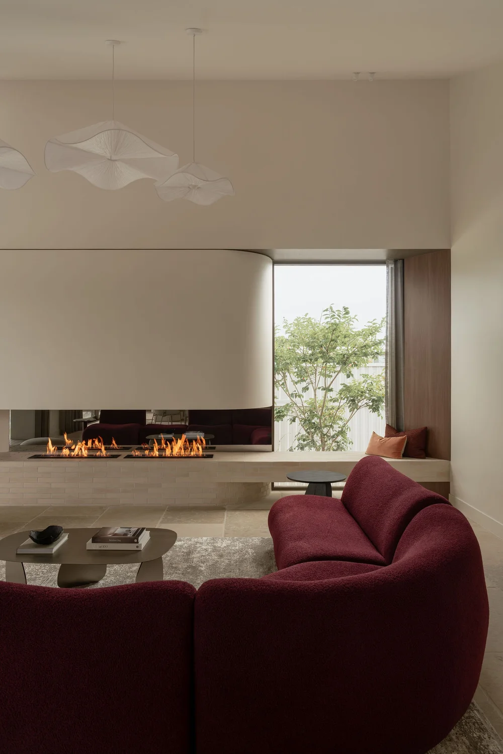 Sculptural pendant lighting above the ZOEI living room.