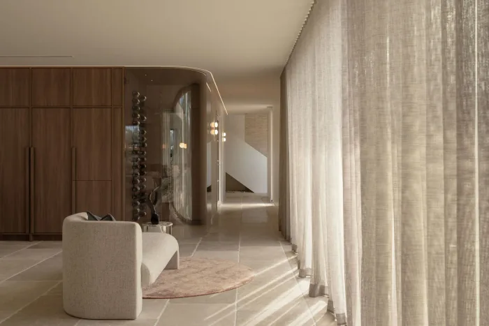 Sheer curtains and the limestone stair at ZOEI, a soft setting for portraits.