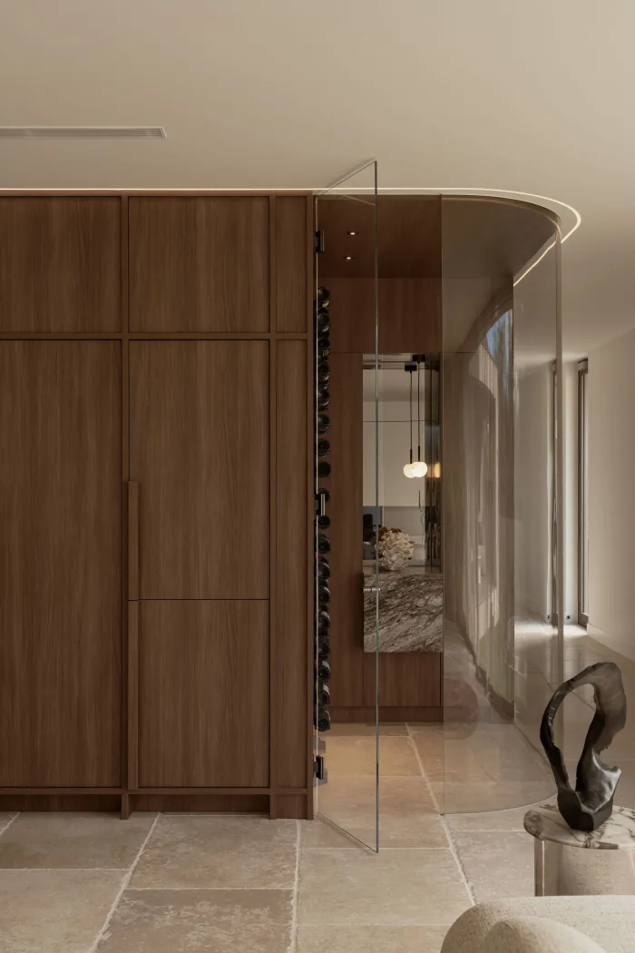 Walnut joinery and the curved glass wall at ZOEI.