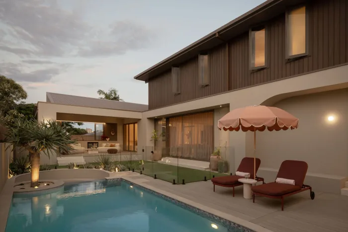 The pool at ZOEI at dusk, included in the Poolside Luxe package.