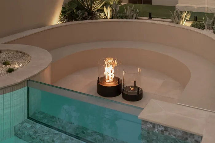 The sunken firepit beside the glass edged pool at ZOEI.